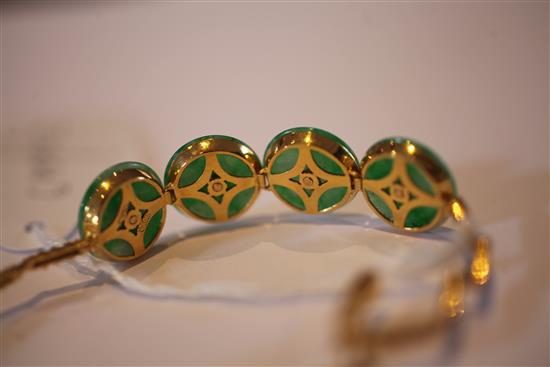 A Chinese high carat gold and jadeite bracelet, gross weight 15.5 grams.